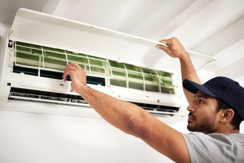 Maintenance, air conditioner technician and man with filter, working on ventilation or ac repair. C